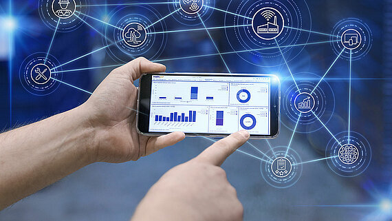 A cellphone with a dashboard from Leadec.os with light effects. 
